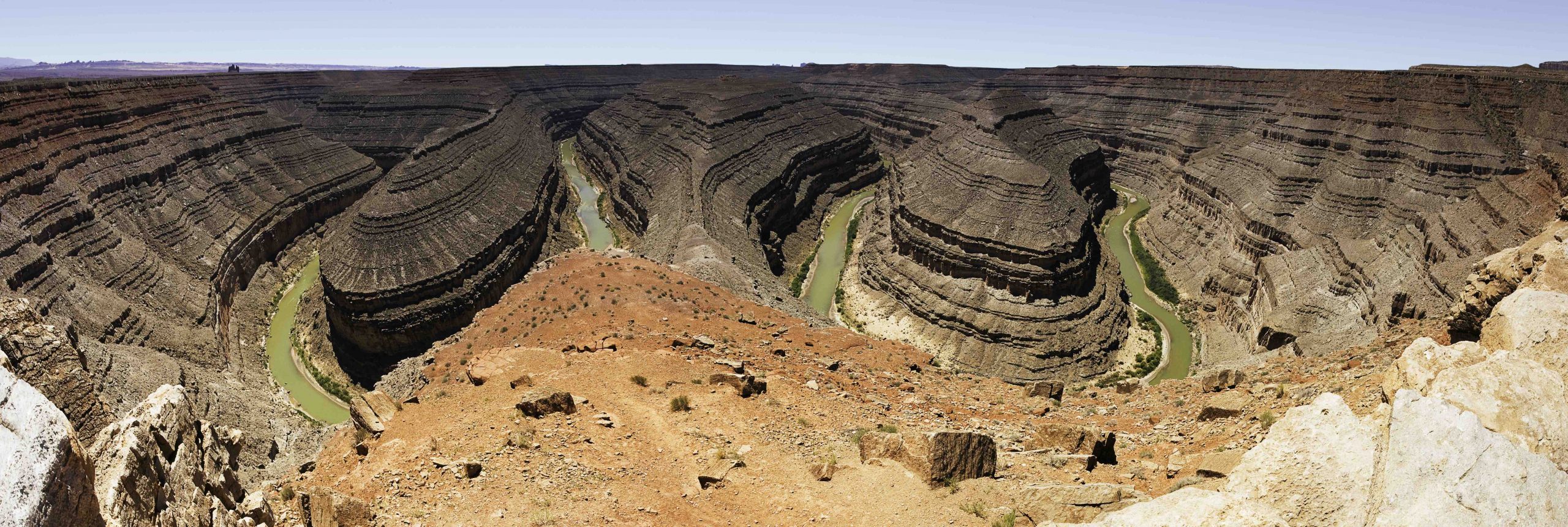 Panoramic view of the San Juan River that shows lateral continuity as layers of rock would have connected across each canyon.