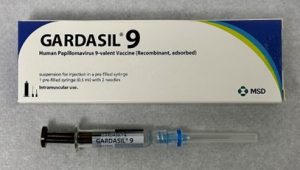 Picture of the box package for the vaccine, Gardasil and the syringe for administering the drug.