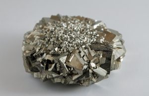 Metallic luster in gold-colored pyrite with observable cleavage.